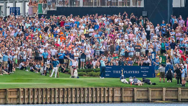 Scottie Scheffler hits his tee shot from the tee box on the 18th hole during the final round of the Players Championship at TPC Sawgrass in Ponte Vedra Beach, Fla.